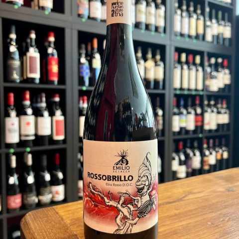 a bottle of wine and a glass of beer on a table