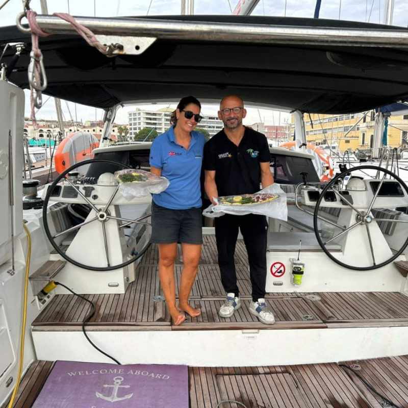 a person standing next to a boat