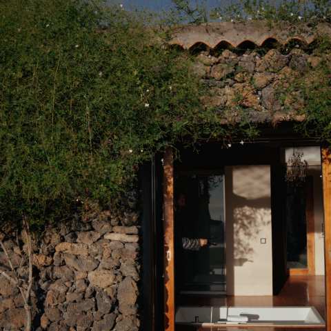 a bench in front of a brick building