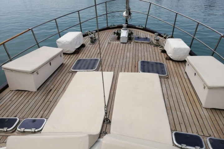 a boat that is sitting on a dock next to a body of water