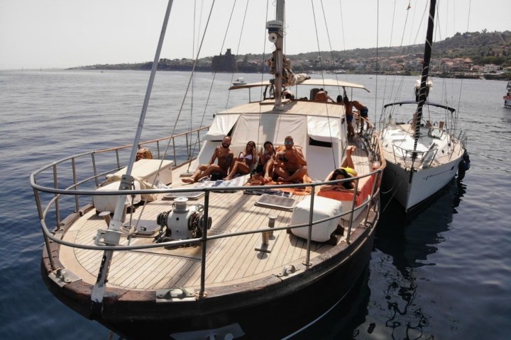 a boat is docked next to a body of water