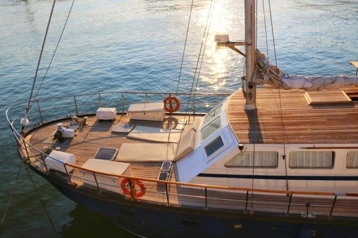 a boat is docked next to a body of water