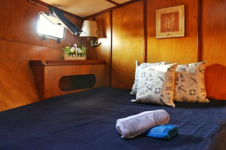 a bedroom with a bed in a room