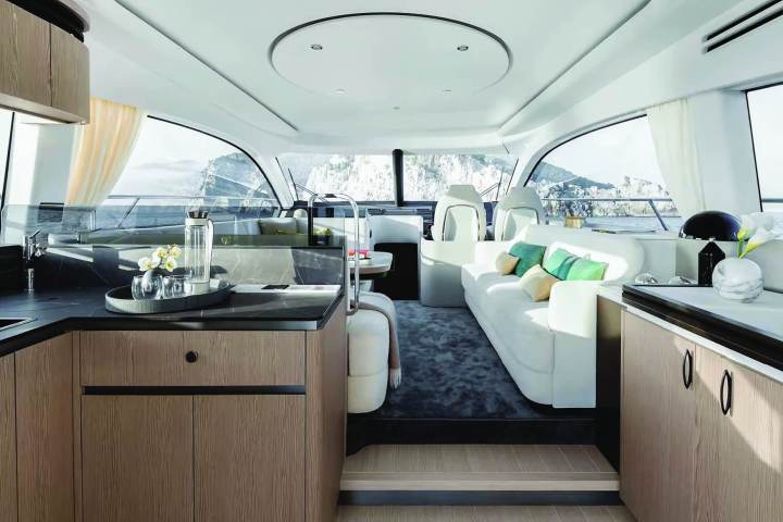 Luxurious yacht interior with modern furnishings and large windows.